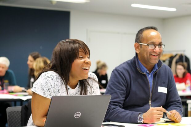 A photo of people at an event about public services.